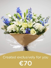 Hand tied bouquet made with seasonal flowers..